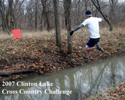 Photo of jumping the creek at Clinton XC race.