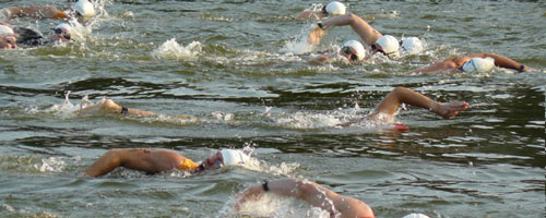 Photo of swimmers at Midwest Mayhem Triathlon at Lone Star Lake.