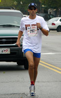 Photo of 1st overall male in the Mass Street Mile.