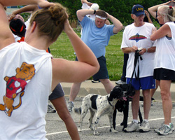 Photo of Red Dog among participants stretching.