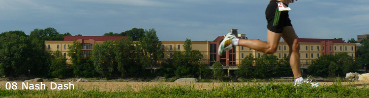 Photo from the 2008 Nash Dash, runner's leg with Outlet Mall in background.