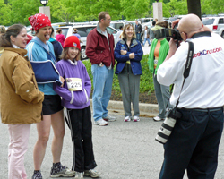 Photo of Dick Ross taking photo at Mothers Day Run.