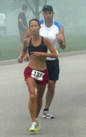 Photo of Karen Hyde nearing the finish.