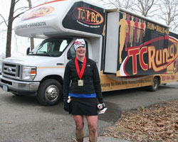 Helen Lavin and the TC Running Club bus.