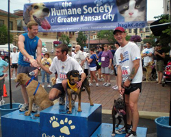 Photo of Spank and Keith Dowell on awards podium at KC Dog Run.