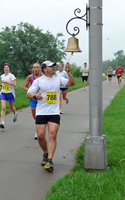 Ringing the bell on the half marathon course.