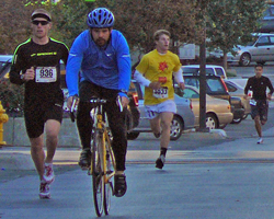 Photo of Tim Testa on Mass St at the Head for the Cure 5K at 8 am,