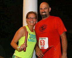 LaRisa and Brian Lochner with their winners' dynamite sticks from the Iola Mad Bomber 5K.