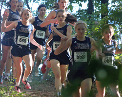 Photo of St James girls running down the first hill.