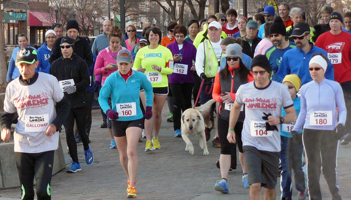 Photo of the 5K group run en masse on Mass.  Jeff Galloway is on the left; J. Jenkins on the right.