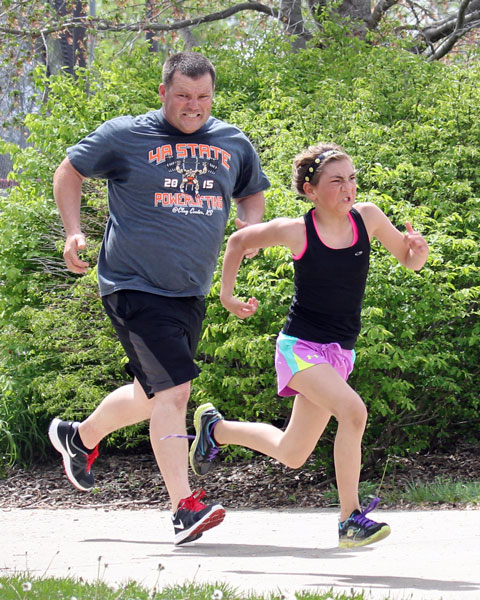 Sprinting to the finish and for family pride at the Sunflower Marthon CLub 5K on April 17, 2016.