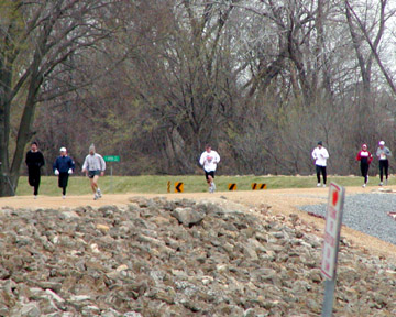 a line of runners on the leve near the finish