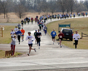Photo of 5K runners going to their left and 12K runners to their right