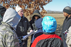 Photo of Dick Neuburger giving instructions to Scout Troop 304.